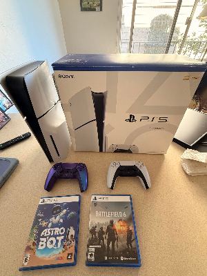 Like-New PS5 Slim Disc Edition (1TB) + 2 Controllers (White & Purple) + Astro Bot & Battlefield 6 — Complete in Box 1