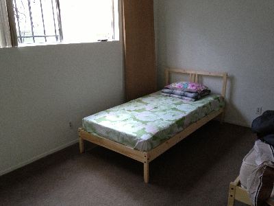 Used IKEA Twin Bed (wooden frame, slatted base and spring mattress) -- everything included 1