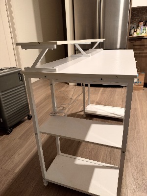 White 47in desk with drawers and power strip 3